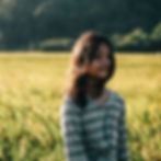 Girl in field by Aniq Danial on Unsplash