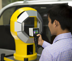 A man holding a 3D Body scanning tool