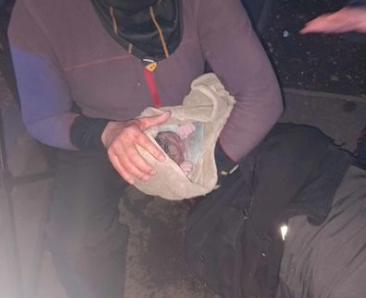 An Algerian migrant helps a woman give birth on the sidewalks of Paris