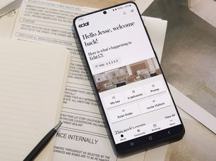 The Eclat Melbourne coworking Eclat App shown on a mobile device sitting on an office desk