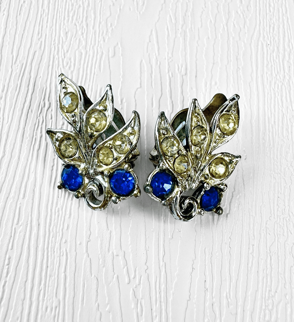 Vintage silver tone leaf clip earrings with clear and vivid blue rhinestones