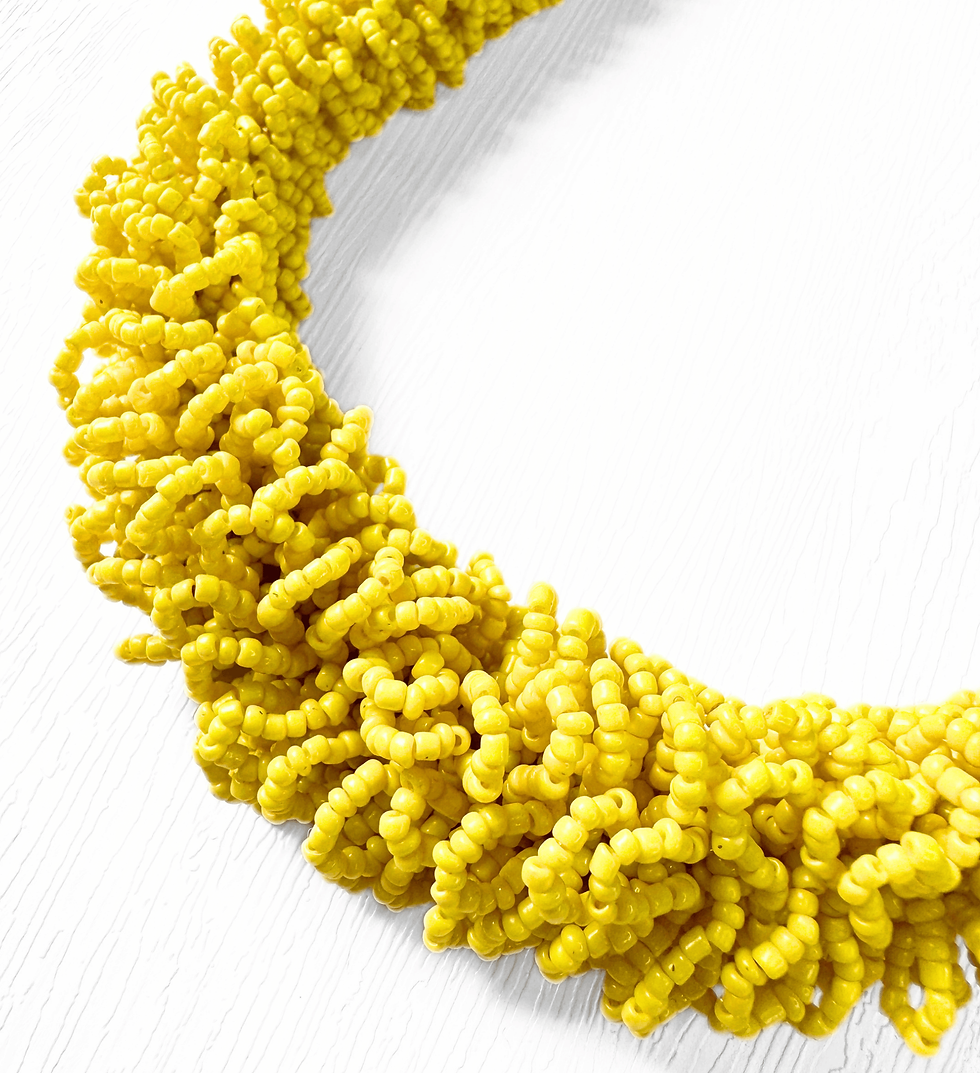 Thumbnail: Close-up of yellow seed bead loops on vintage statement necklace