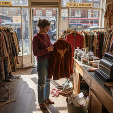 Woman shopping in vintage clothing store
