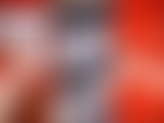 Close-up of three football shirt tags: Adidas with flags, Umbro with "Made in England," and a red Candy jersey with a blurred pattern.