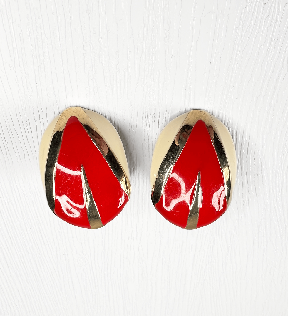 Thumbnail: front view of red enamel and cream oval clip on earrings with gold detailing
