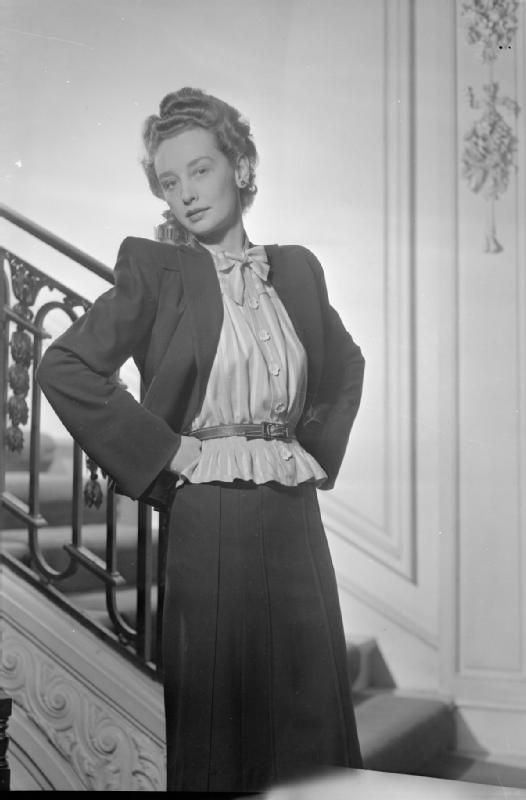 1930s woman wearing a blouse with a bow-tied neckline
