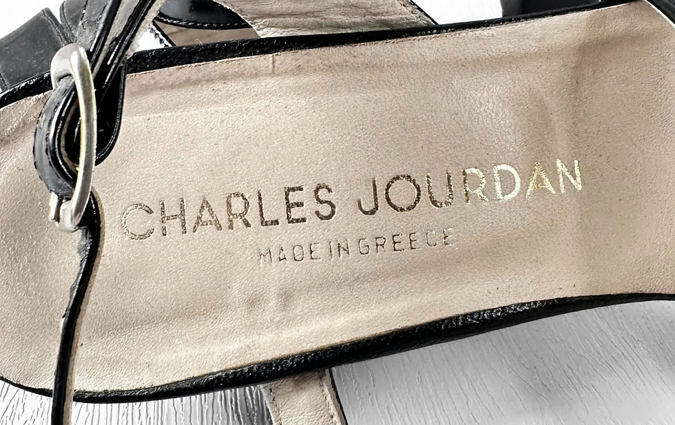 Close-up of a beige Charles Jourdan shoes, showing the text Made in Greece.