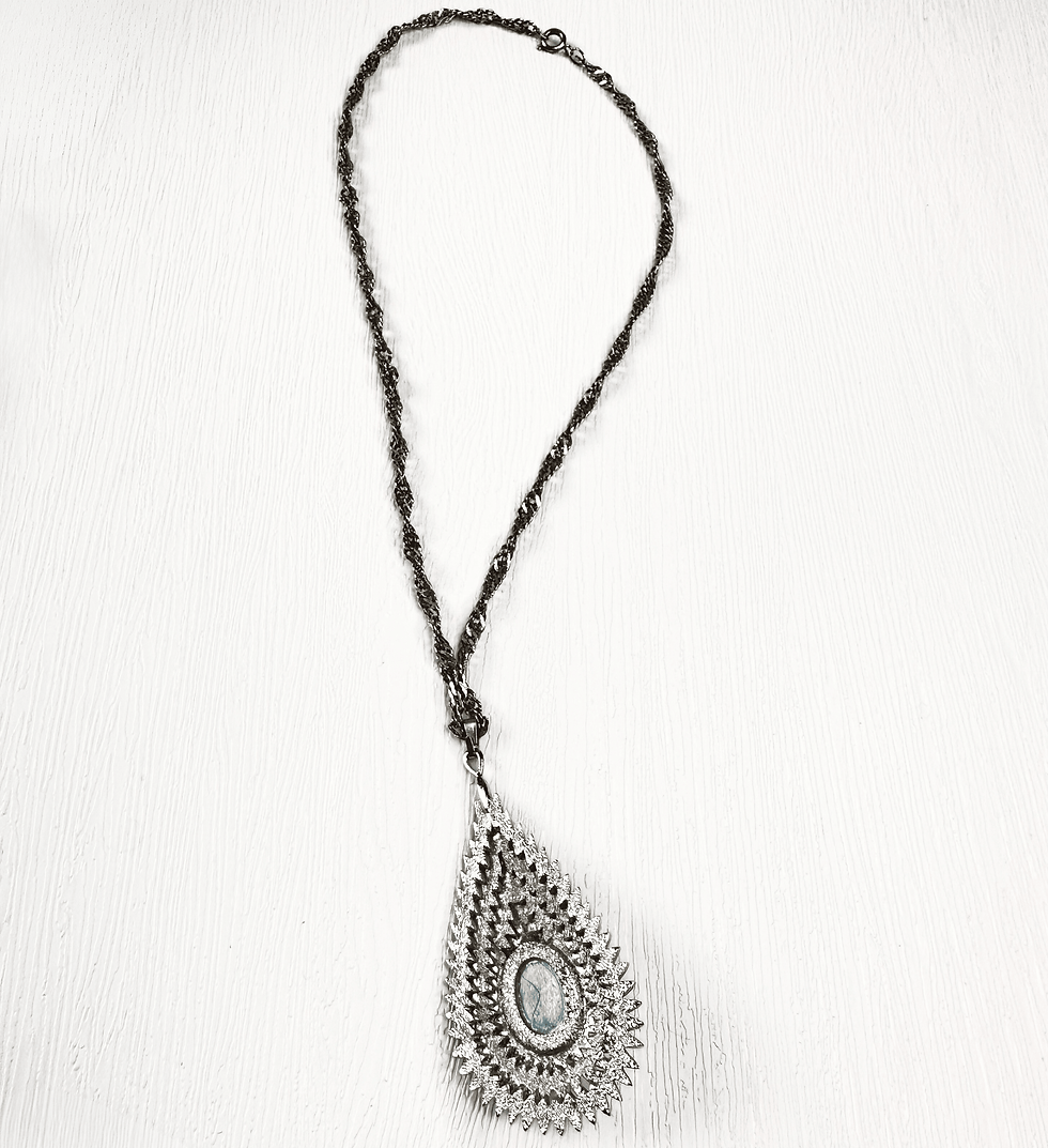 Thumbnail: silver tone necklace with feather patterned teardrop pendant on white background