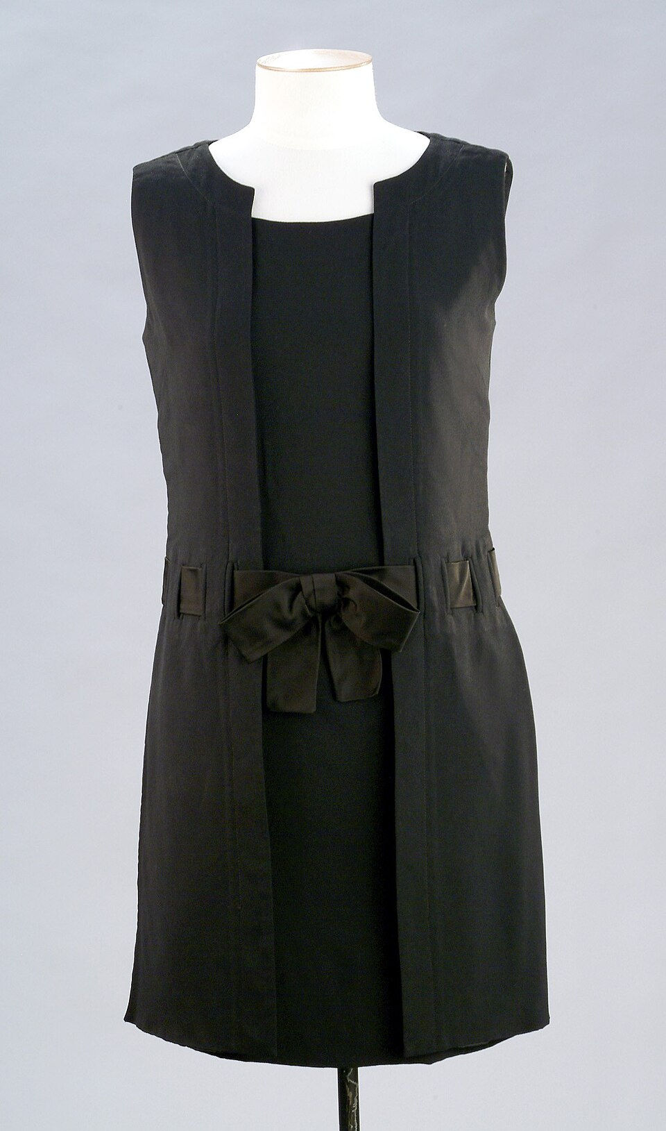 1960s black vintage dress with a structured bow at the waist