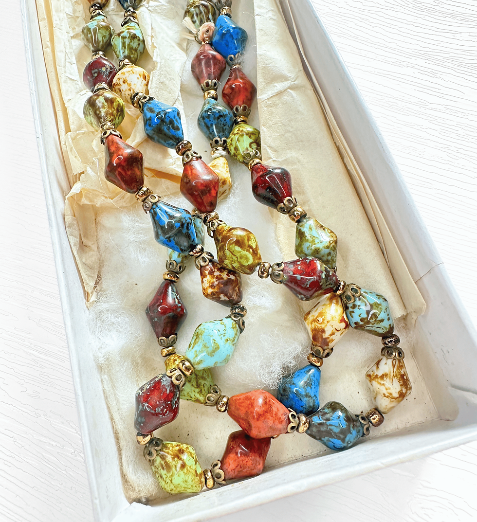 vintage mottled beads close up colourful necklace in presentation box