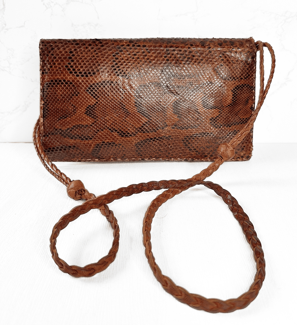 Front view of vintage 1970s tan snakeskin shoulder bag with strap