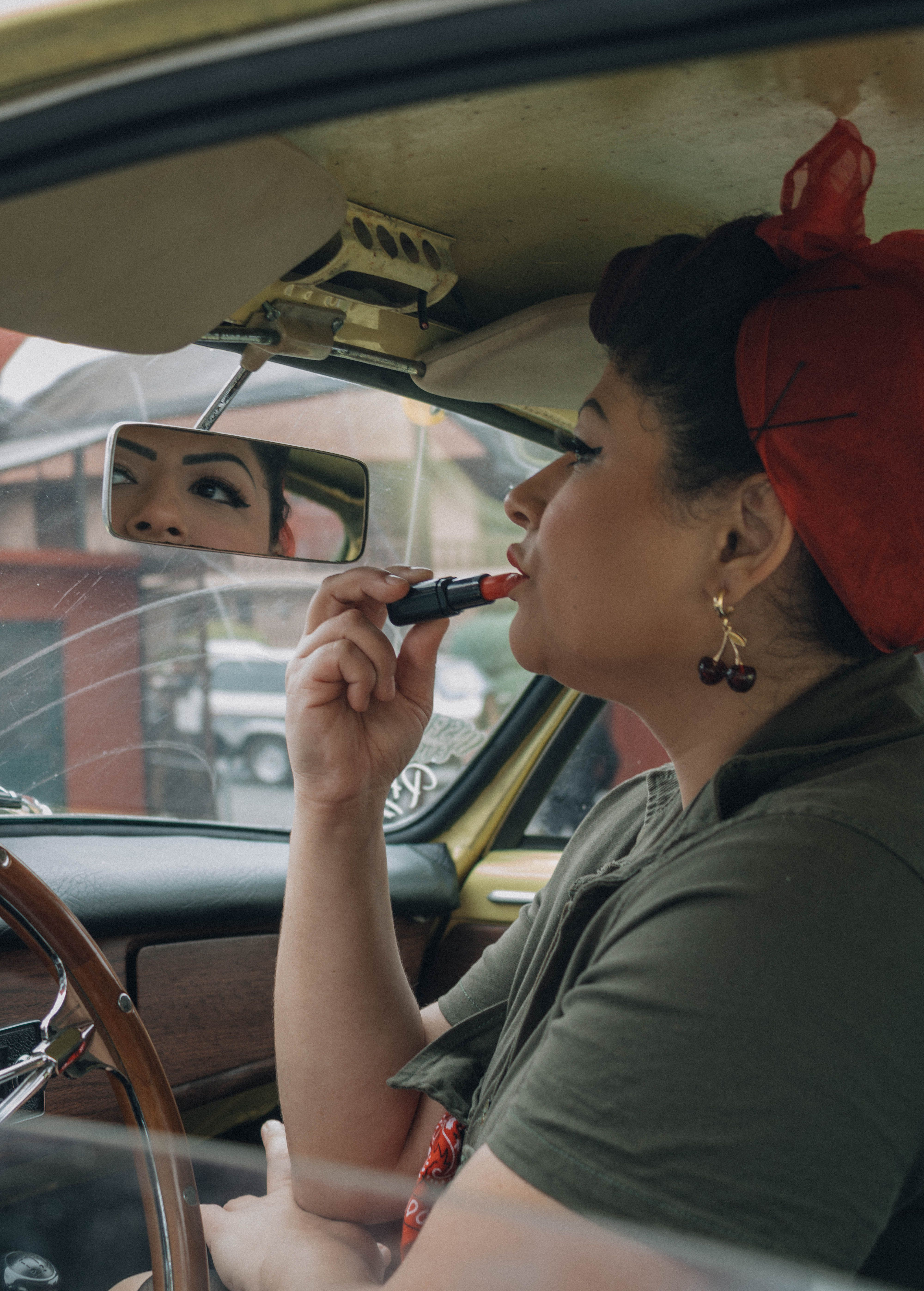 Woman with vintage-inspired red lipstick and winged eyeliner