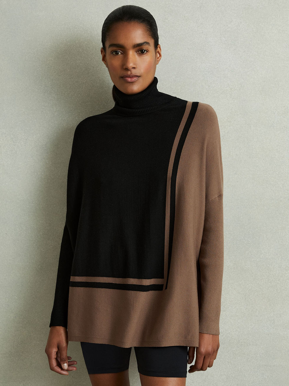Reiss Sophia Colorblock Roll Neck Split Hem Top in Black and Mink Styled Front View