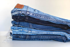 blue denim jeans on white textile_edited.jpg