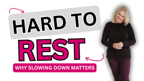 Shelley Beyer standing softly against a white background, hands folded, wearing a black top — a calm, grounded image reflecting on her breast reduction recovery and what it means to rest, part of her From the Vault series.