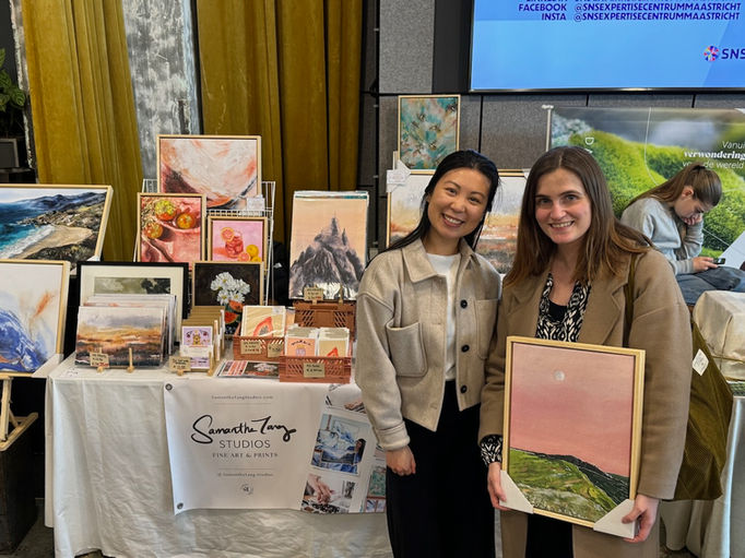 Samantha with customer and Pink Sky Framed Canvas Art print