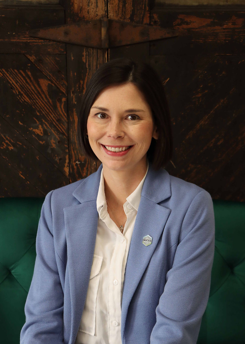 Professional headshot of Kaylee Paffrath, President/CEO of the Moberly Area Economic Development Corporation, smiling and photographed against a neutral background.
