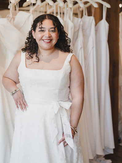 Bride smiling in a square neck dress from the RISE collection