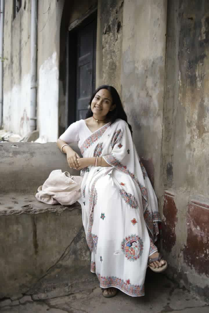 Thumbnail: Geetanjali ‘Ganga’ Handpainted Madhubani Pure Crepe Silk Saree with Mirror work