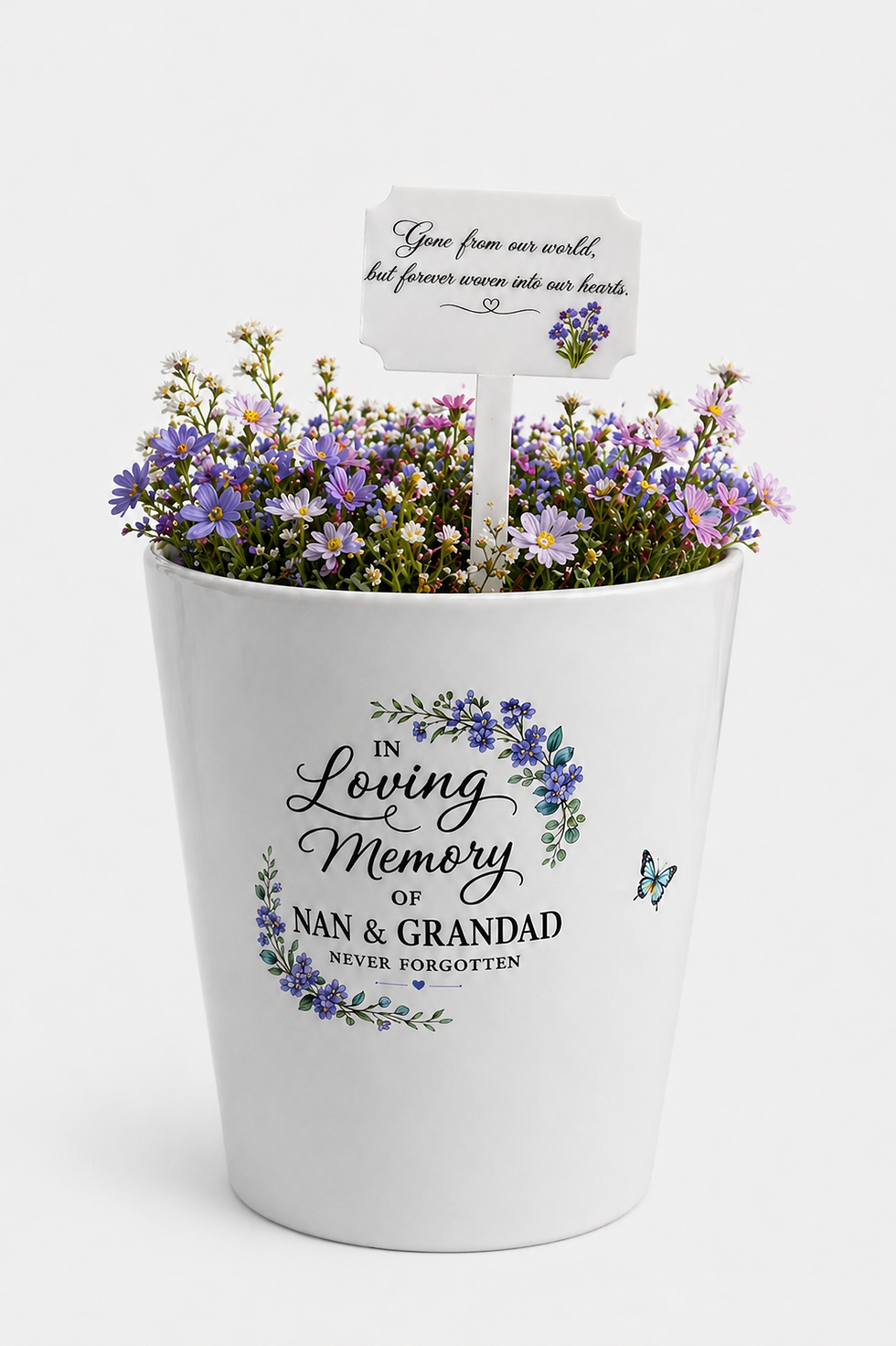 Memorial pot with purple flowers, text 'In Loving Memory of. It can be personalised  