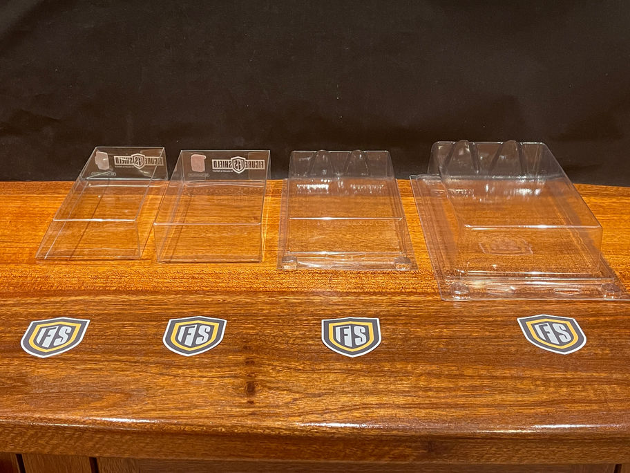 Four clear acrylic display cases
