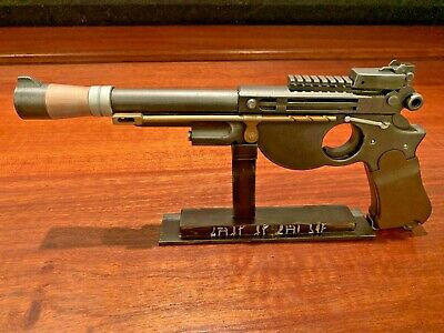 Detailed view of a vintage-style firearm displayed on a stand
