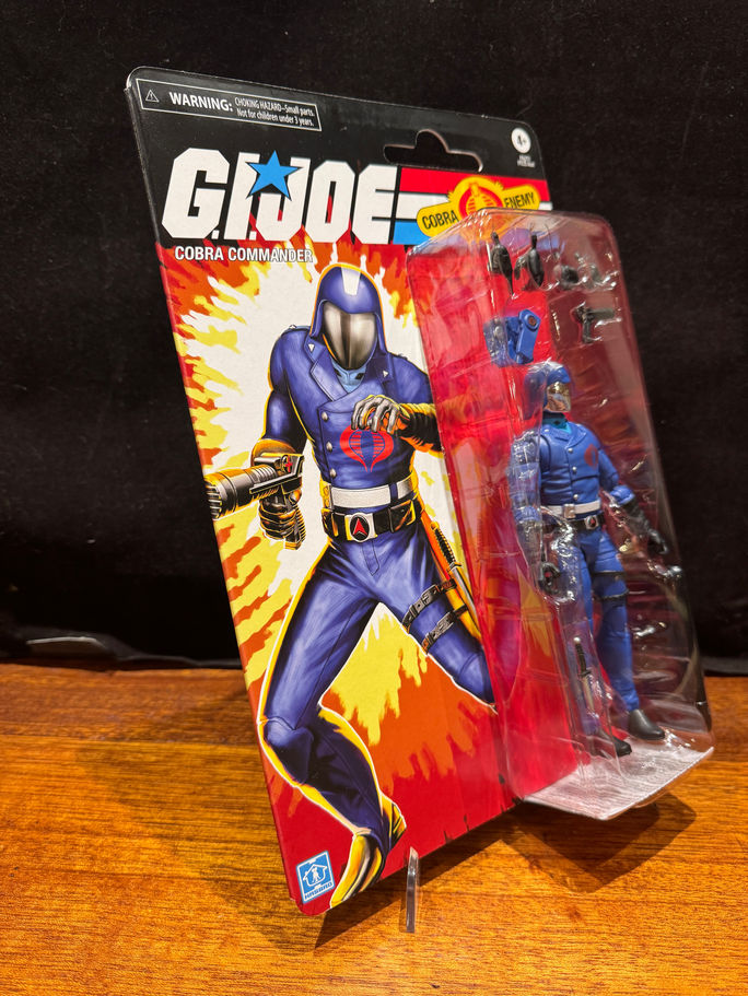 GI JOE action figure in package, blue uniform poses with weapon RAWSTARWARS