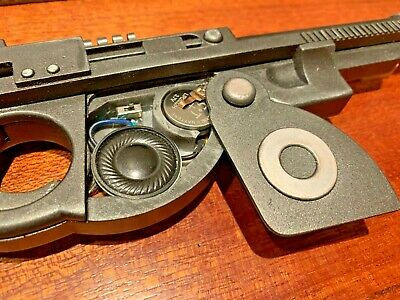 Disassembled toy gun revealing internal components