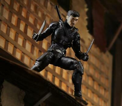 Black-clad action figure poised for attack, RAWSTARWARS