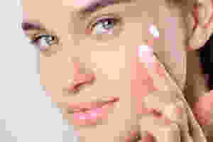 Beautiful-model-applying-skin-care-creams-best-beauty-products-to-buy for 2019.: ultimate-makeup-and-skin-care-must-haves