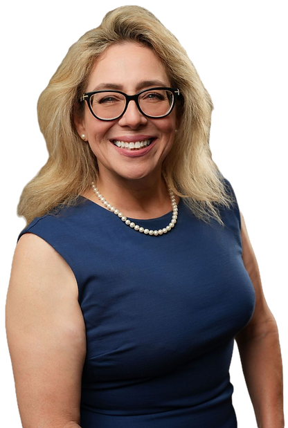 Another image of Tara Hallmark in glasses and blue dress smiling.