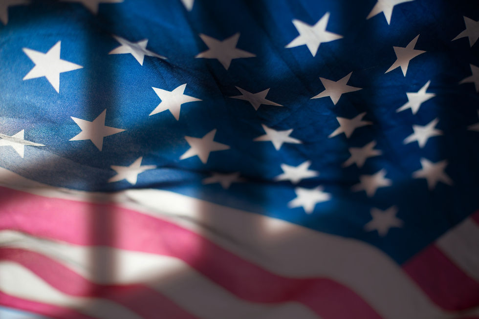 American flag waving, stars and stripes visible