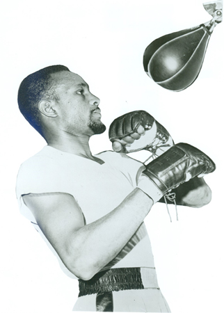 Cokes hits the speed bag during a training session