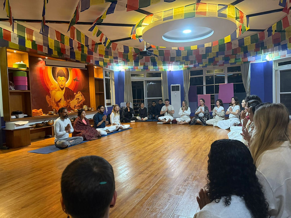 Eye-level view of a peaceful yoga retreat center surrounded by mountains