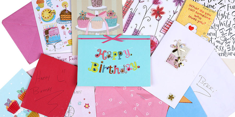 Pile of colorful birthday cards and envelopes, the kind of collection that piles up every year