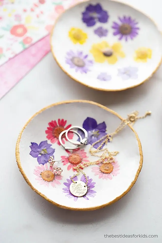 A hand made clay hand-pressed flower dish with gold trim courtesy of bestideasforkids.com