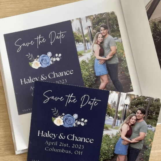 Save-the-date cards for Haley and Chance ready to be added to a Cardkive memory book