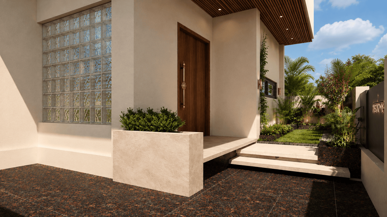 Entrance view of Hari Darpan showcasing a solid timber main door, glass block feature wall, landscaped side garden, natural stone flooring, and a warm contemporary architectural palette.