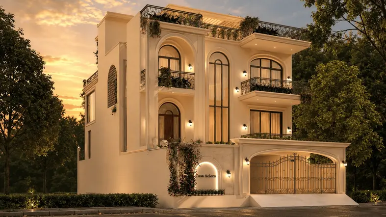 Front facade of Casa Aurelia, a Mediterranean-inspired luxury residence featuring grand arches, wrought-iron balconies, warm stucco walls, landscaped surroundings, and soft evening lighting at golden hour.