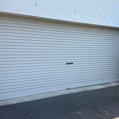 White roller garage door on a residential property in Sydney