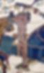 Historic embroidery scene depicting a standing figure in patterned attire, holding a weapon. Several horses in the background, with detailed stitching.