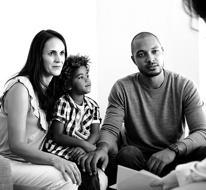 couple-talking-to-family-counselor-2021-