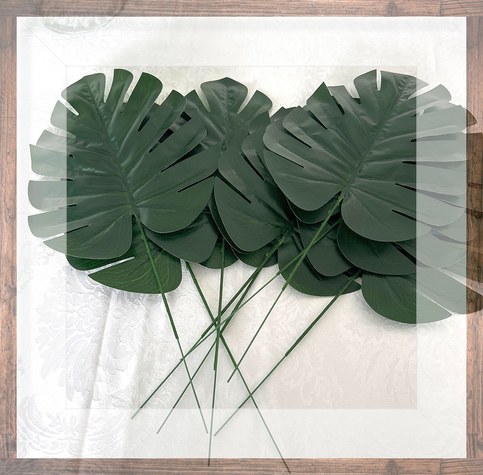Artificial monstera leaves on stems
