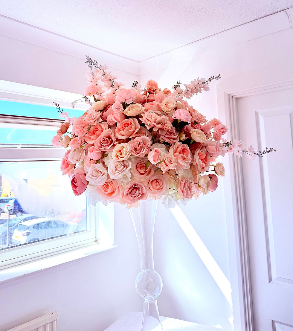 Close-up view of a unique floral arrangement with orchids and rustic branches