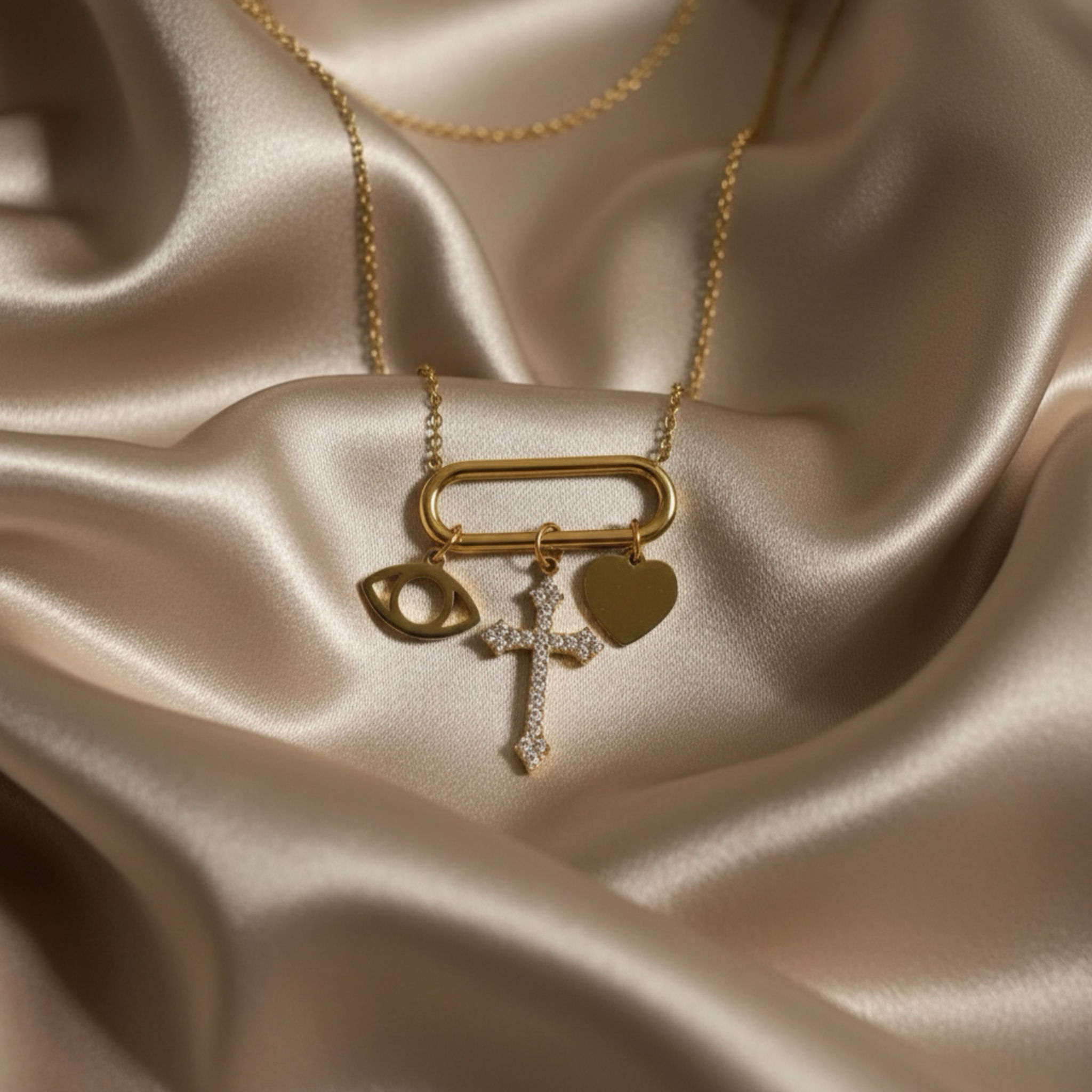 Ella - Ατσάλινο κολιέ με 3 charms σταυρό καρδιά μάτι