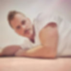 Man in a white shirt lying on a light-colored surface, gazing at the camera. Neutral background, soft lighting, contemplative mood. The New Citizen Kane - The Cage, a music blog powered by Cage Riot
