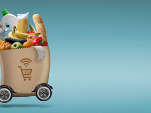 Shopping bag on wheels filled with groceries, including produce, bread, and bottles, on a blue background. Wi-Fi and cart icon on bag.