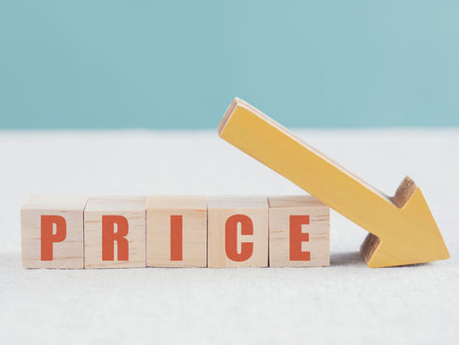 Wooden blocks spelling "PRICE" with a yellow downward arrow against a blue background, symbolizing a price drop.