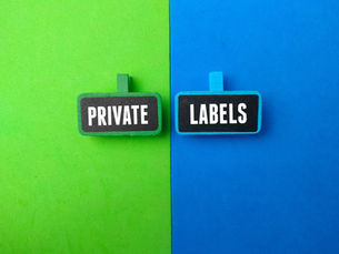 Two wooden signs reading PRIVATE and LABELS on a split green and blue background.