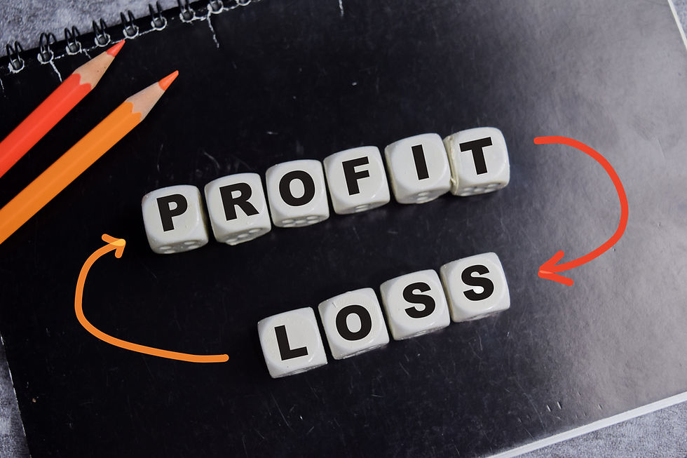 Dice spelling "PROFIT" and "LOSS" on a black notepad. Two pencils and curved arrows link words, highlighting financial theme.